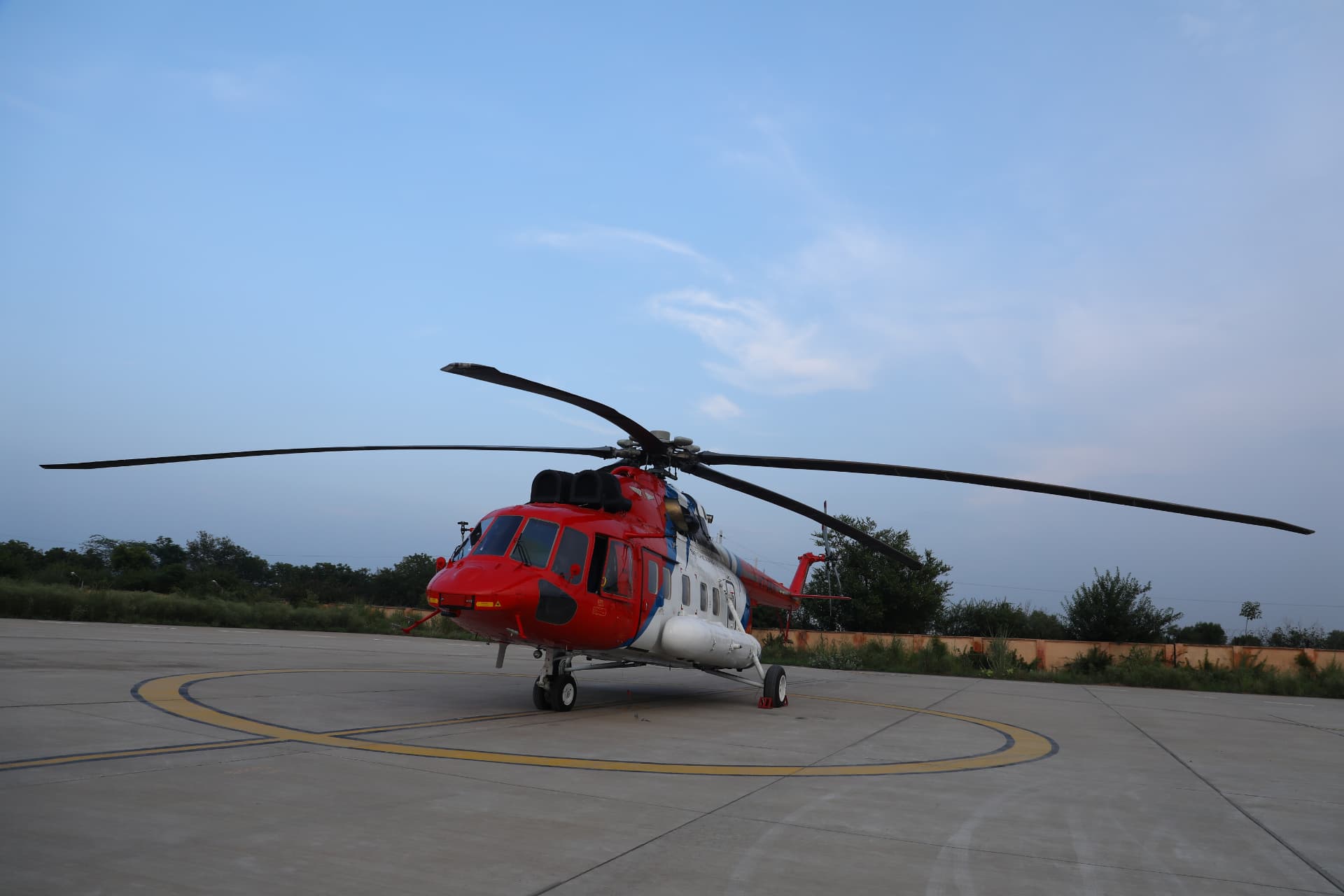 Sky One Airways Mi-172 helicopter parked on a helipad at dusk