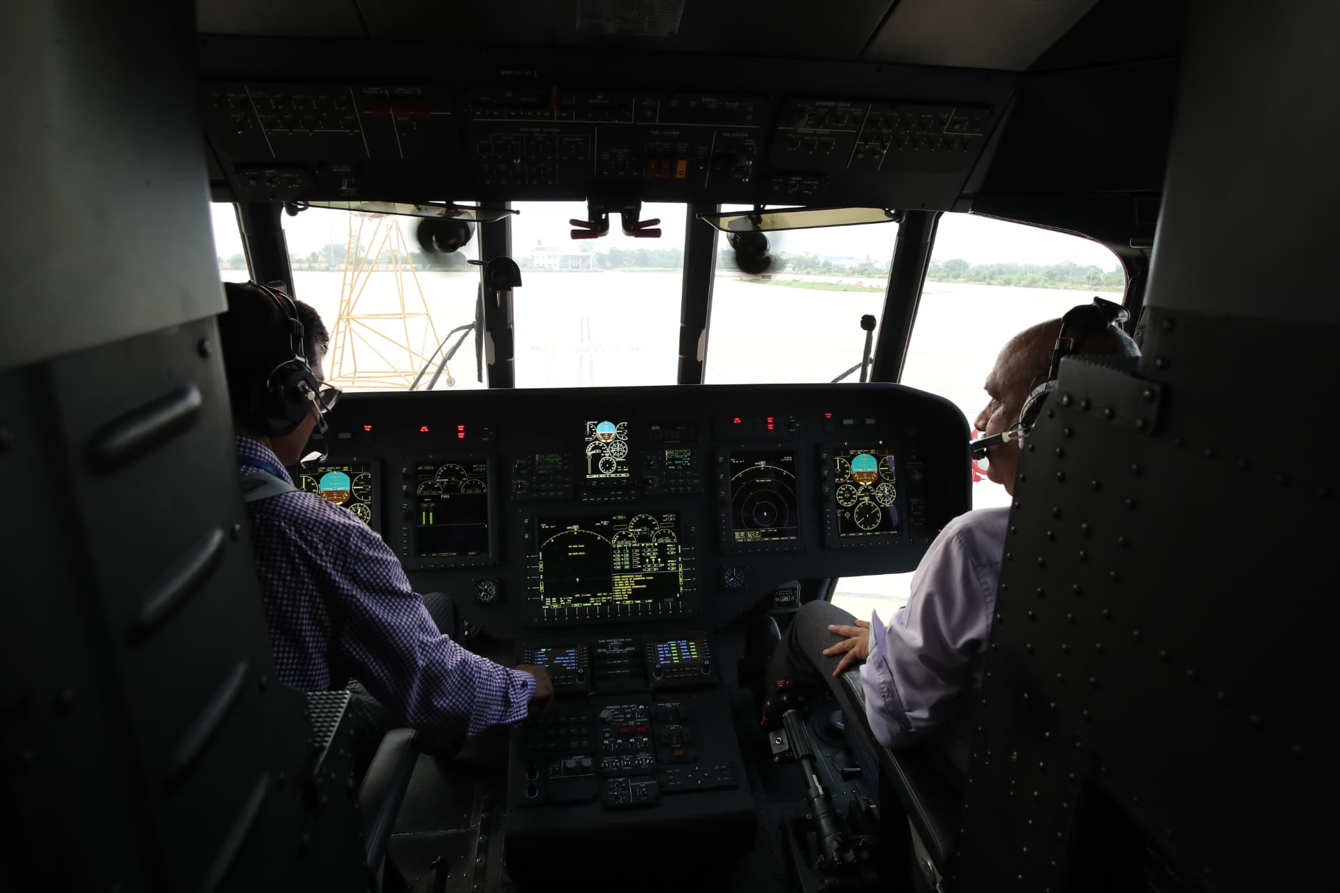 Sky One Airways pilots in the Mi-172 cockpit before departure